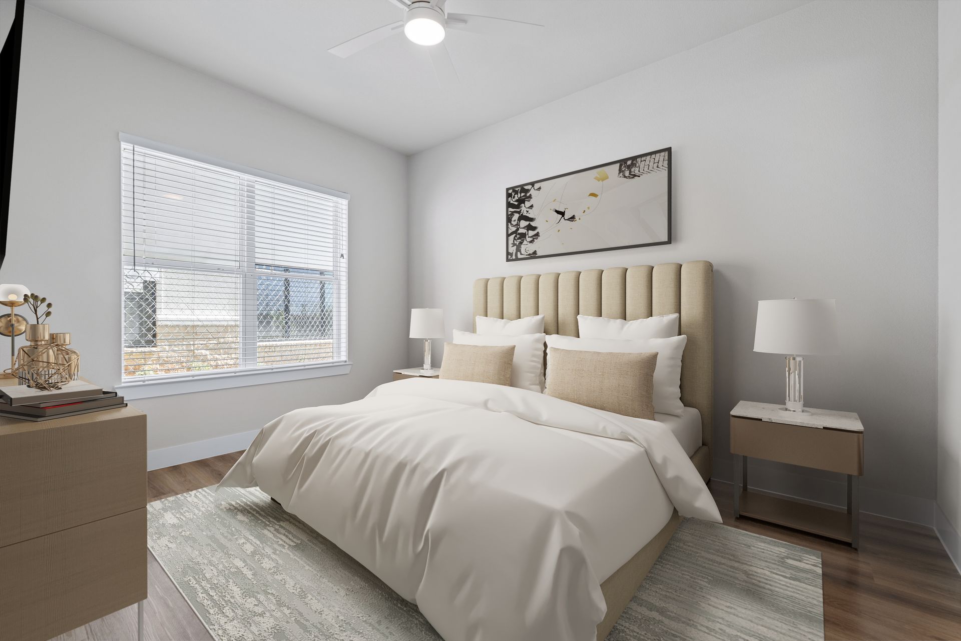 A bedroom with a bed, nightstand, dresser, rug, and ceiling fan at The Wyatt, offers apartments in Austin, TX.
