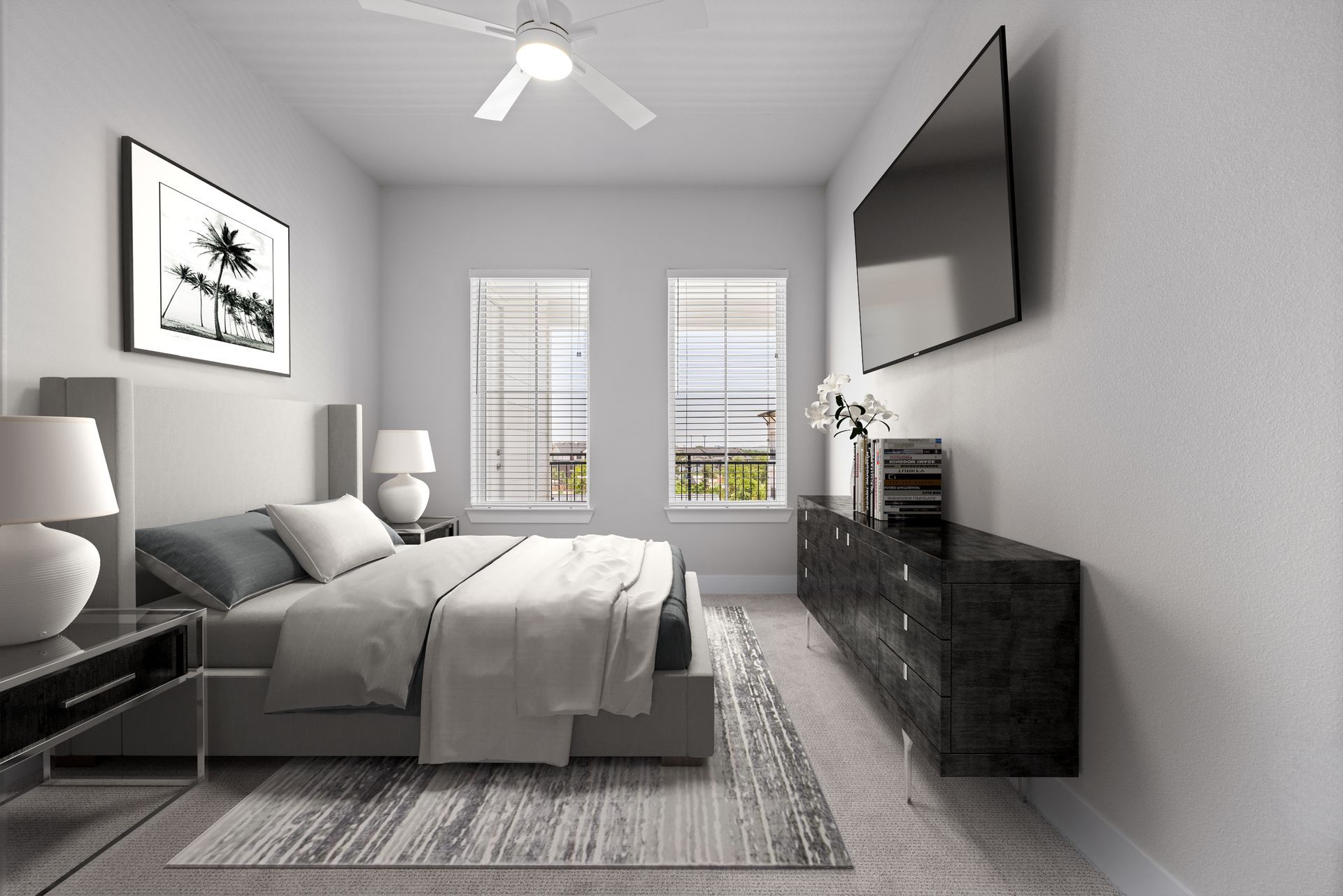 A bedroom with a large bed and a flat screen tv on the wall at The Wyatt, offers apartments for rent in North Austin, TX.