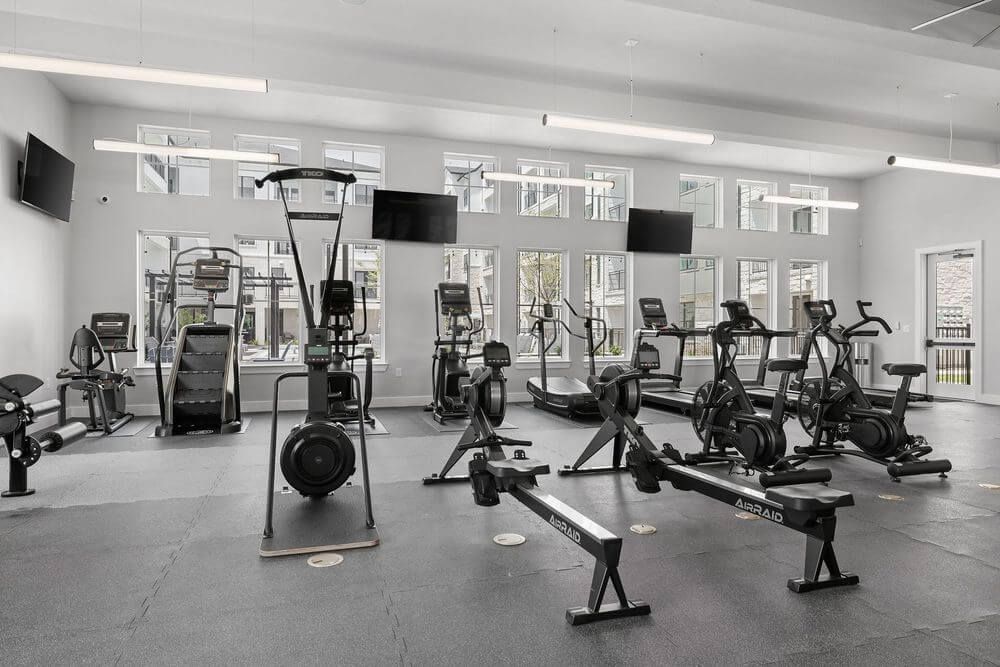 A large gym filled with lots of exercise equipment at The Wyatt, offers brand new apartments in North Austin, TX.