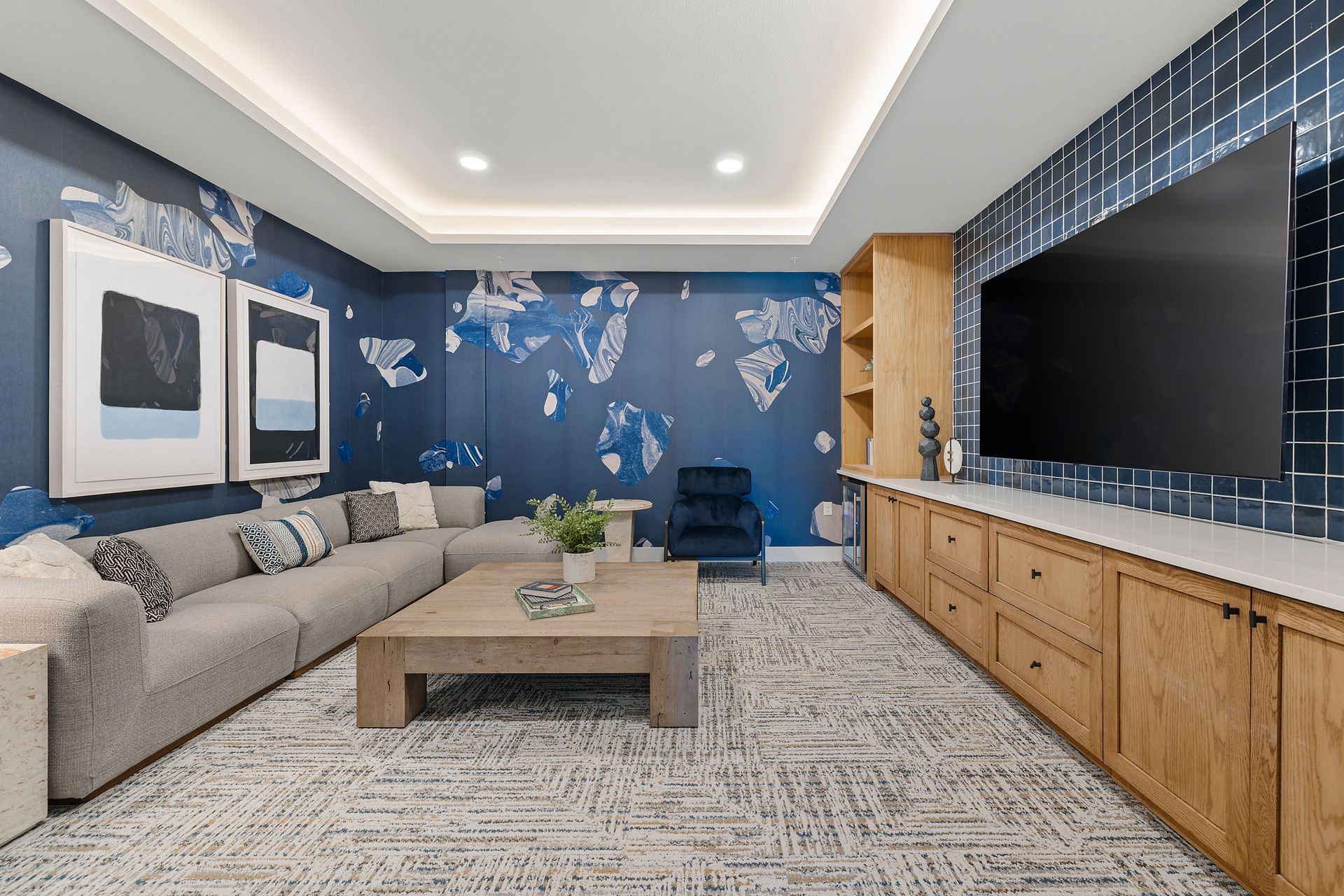 Apartment community media room with a couch and a flat-screen tv at The Wyatt, offers luxury apartments in Brushy Creek Austin, TX.