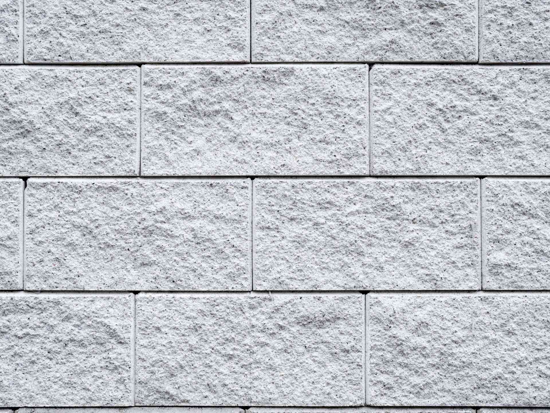 A close up of a white brick wall.