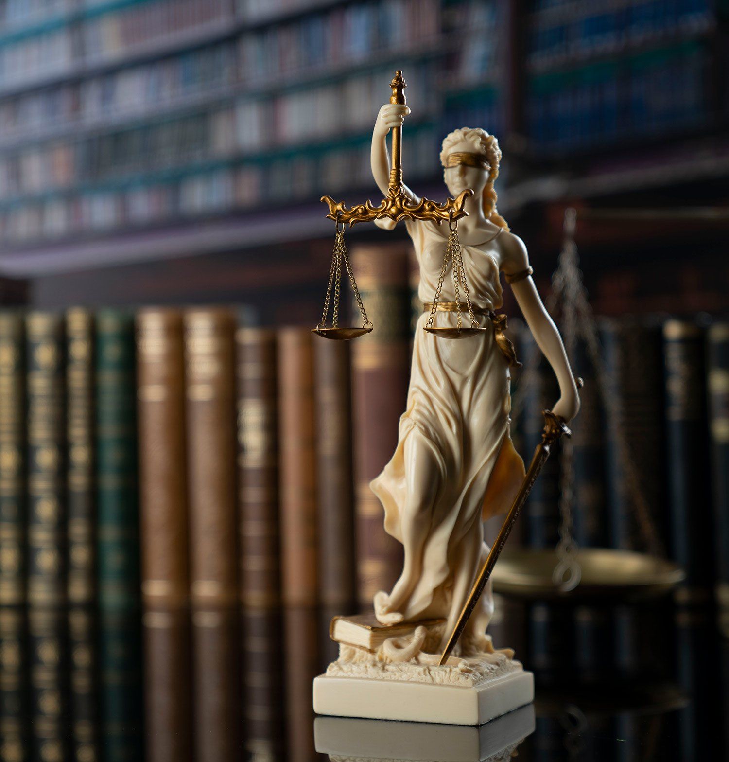 Lady Justice on Table — Peekskill, NY — Sampson Law Group PLLC