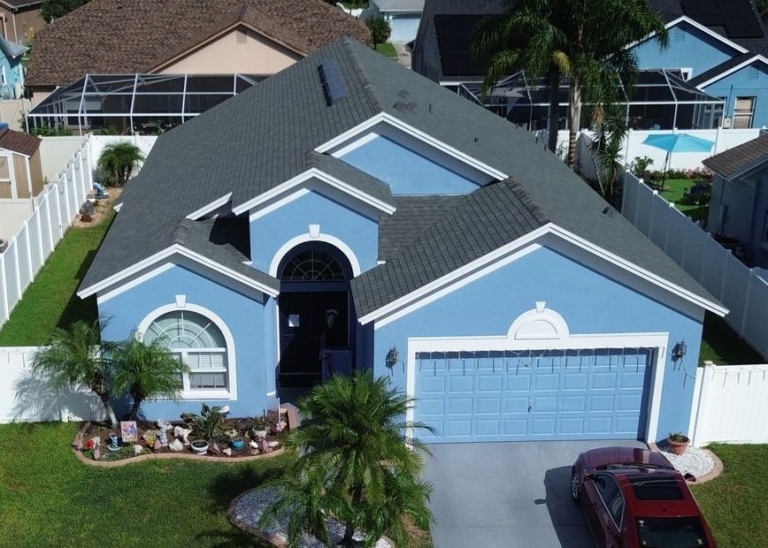 A house with a roof that has shingles on it