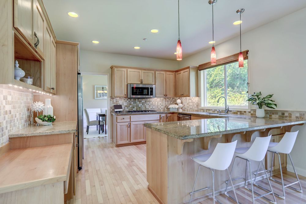 Kitchen With Wood Cabinets, Granite Countertops — Verastone In Fyshwick, ACT