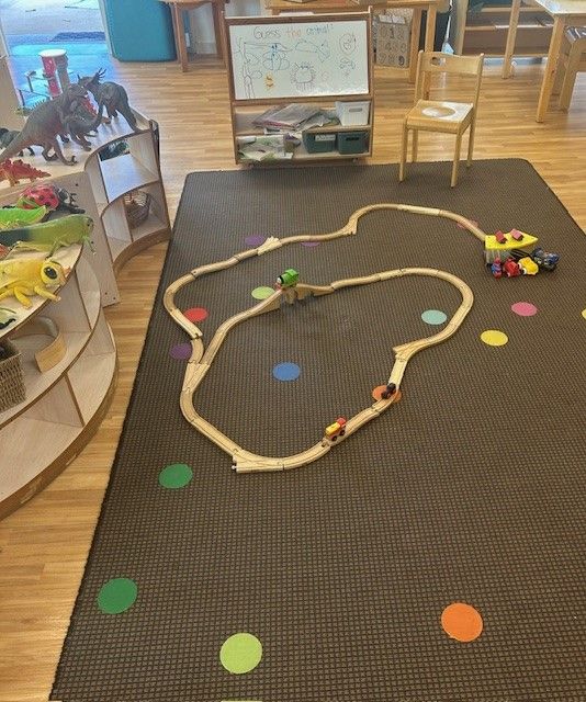 A toy train track is on the floor in a play room — Birralee Child Care Centre Assn Inc In Mackay, QLD