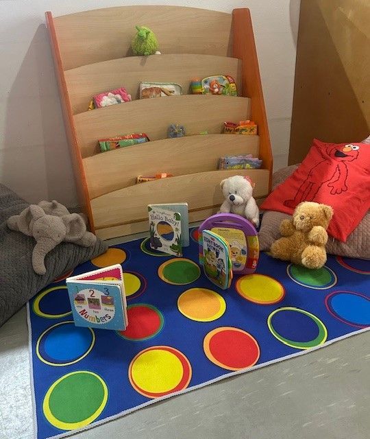 A Book Rack with Teddy Bears And Books — Birralee Child Care Centre Assn Inc In Mackay, QLD