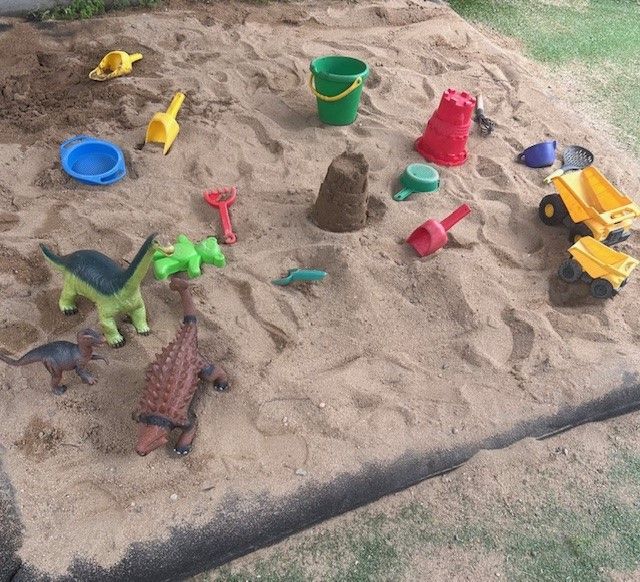 A Group of Children Are Sitting at a Table Painting — Birralee Child Care Centre Assn Inc In Mackay, QLD