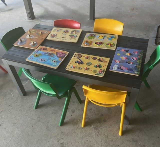A table with a bunch of puzzles on it — Birralee Child Care Centre Assn Inc In Mackay, QLD