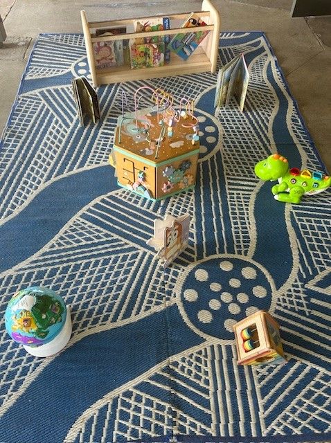 Two Little Girls Are Playing With Toys at a Table — Birralee Child Care Centre Assn Inc In Mackay, QLD