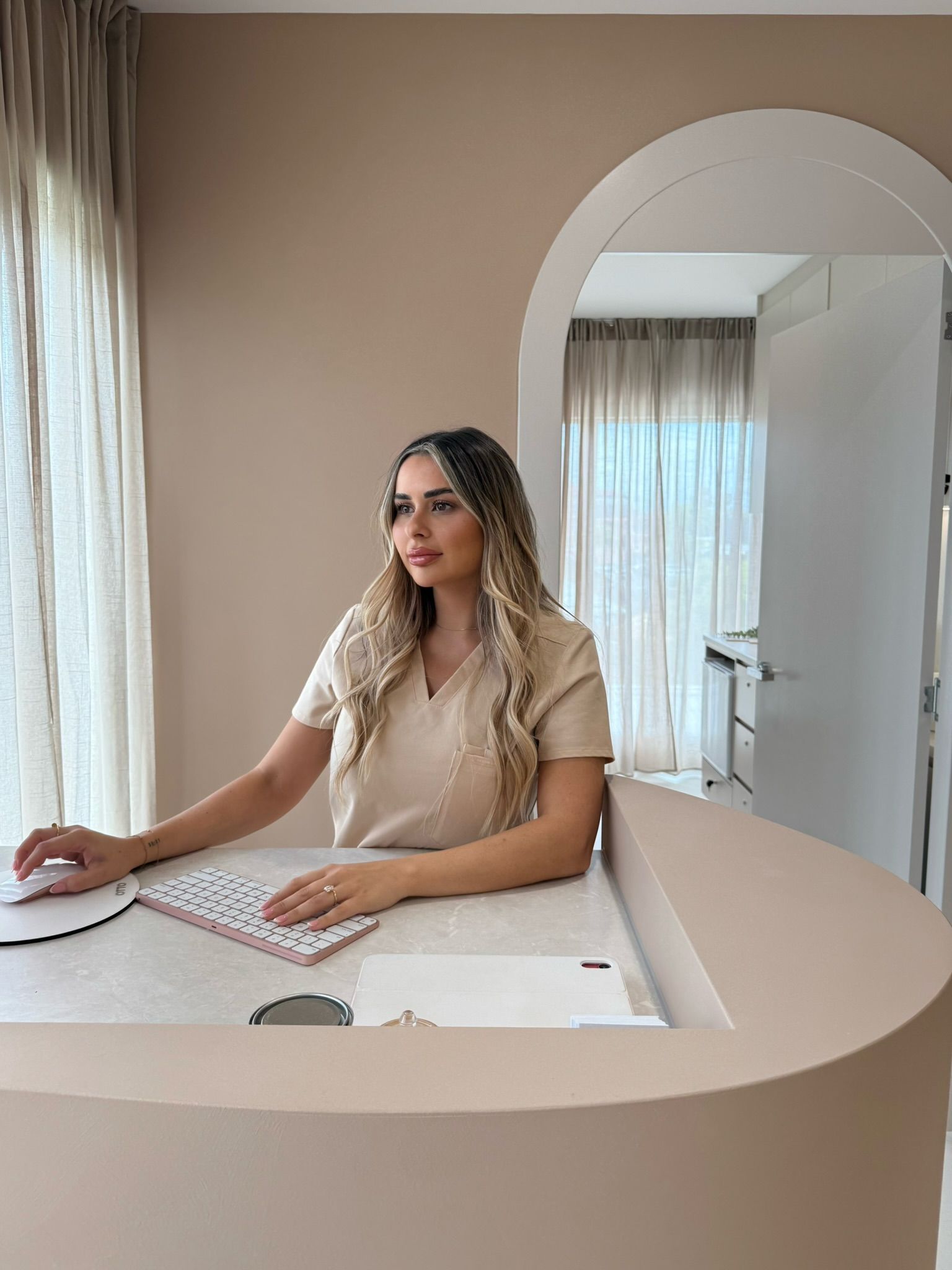 Lady Taking Image Of Clients Treatment  — Doll Empire Clinic in Mermaid Beach, QLD