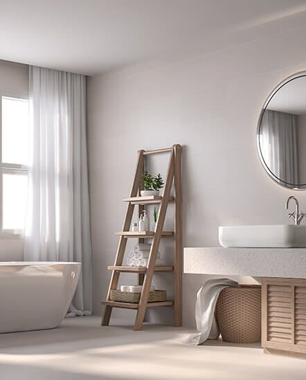 A bathroom with a bathtub, sink, mirror, and ladder.