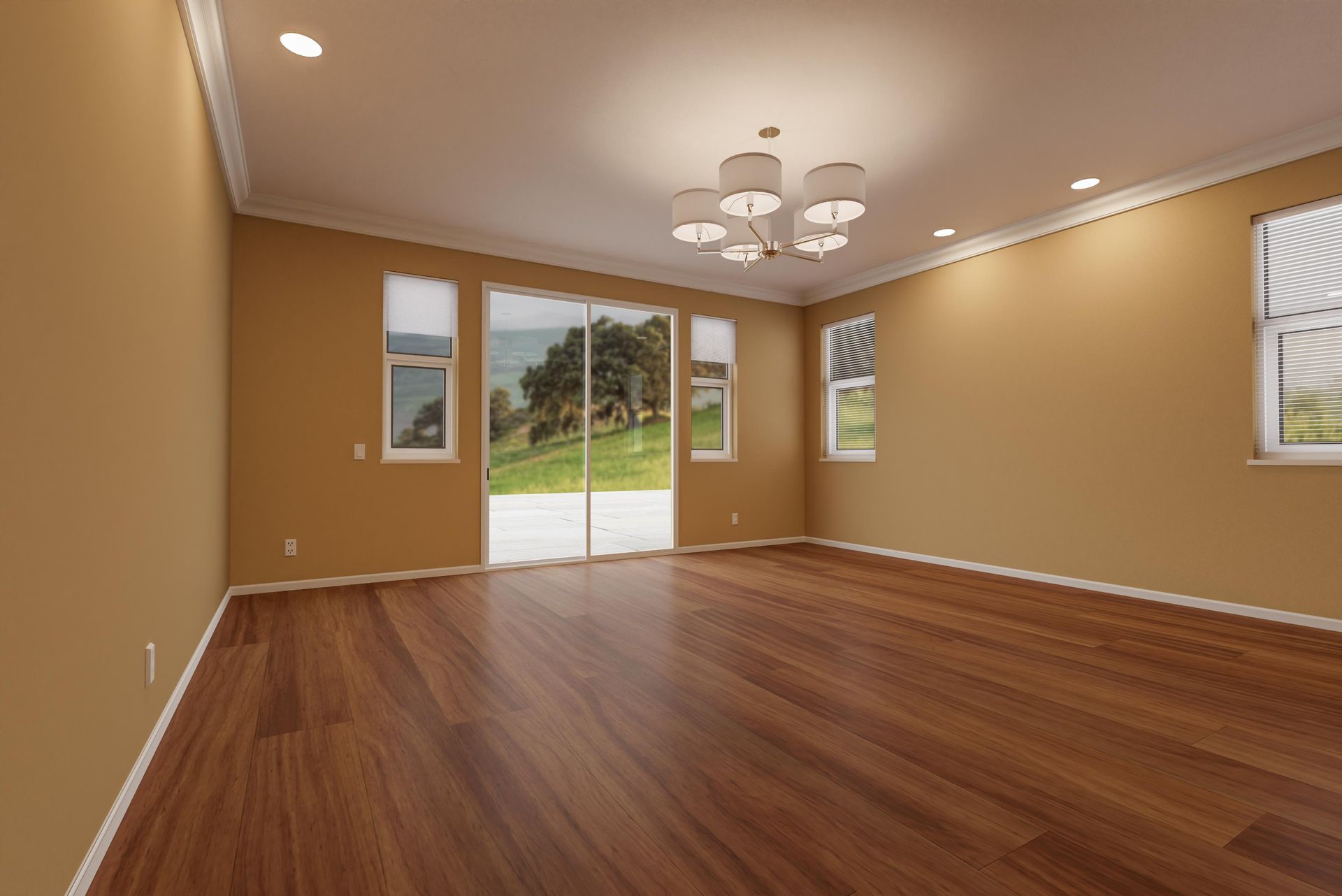 An empty living room with hardwood floors and sliding glass doors.