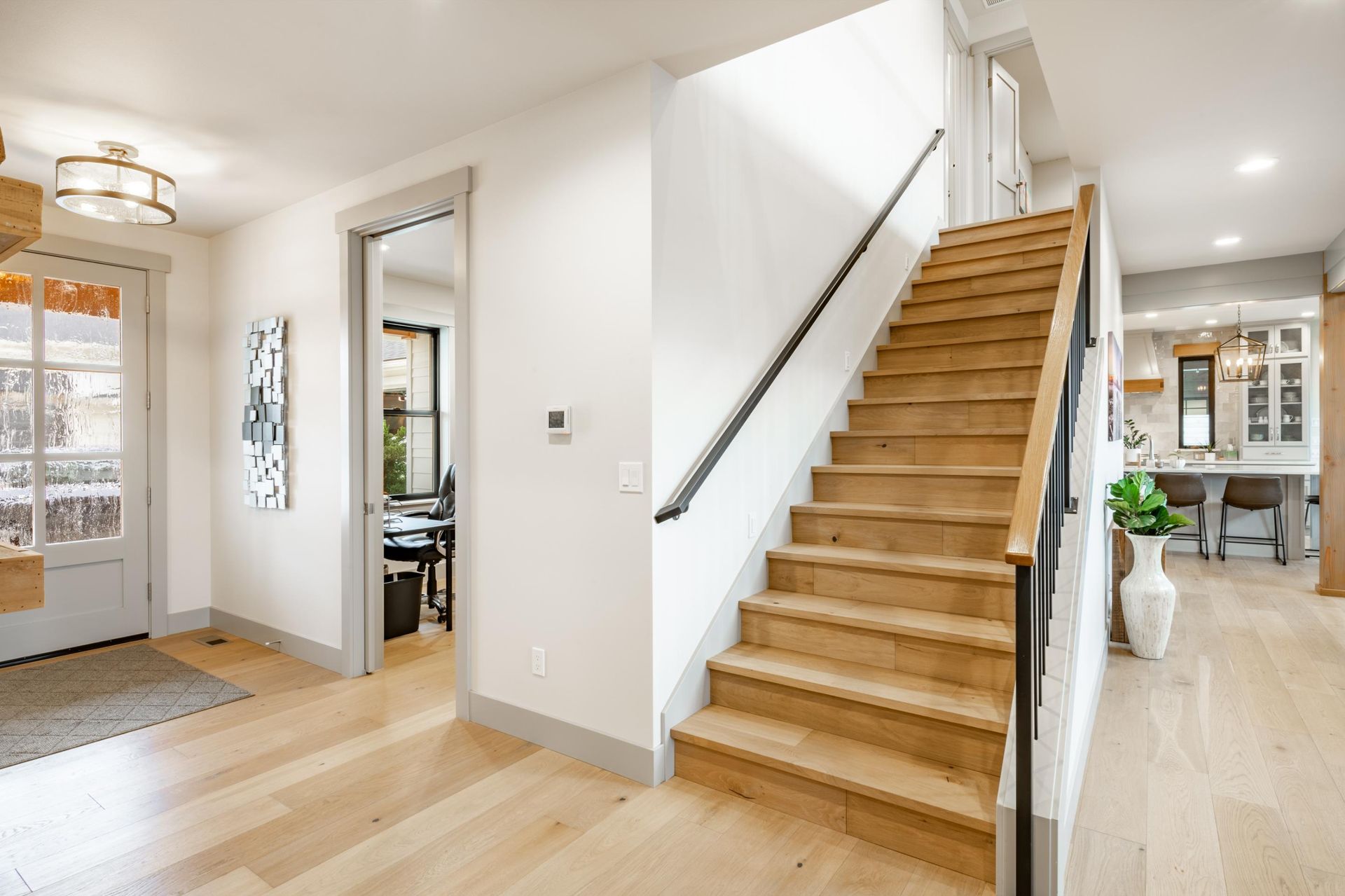 A wooden staircase leading up to the second floor of a house.