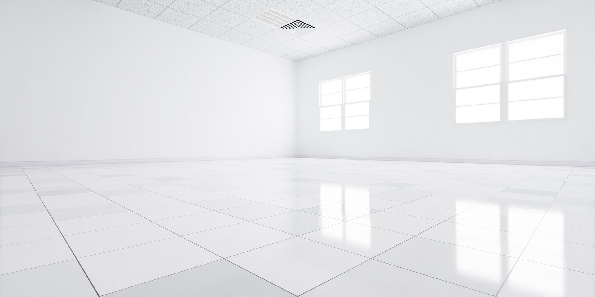 An empty room with white tile floors and windows.