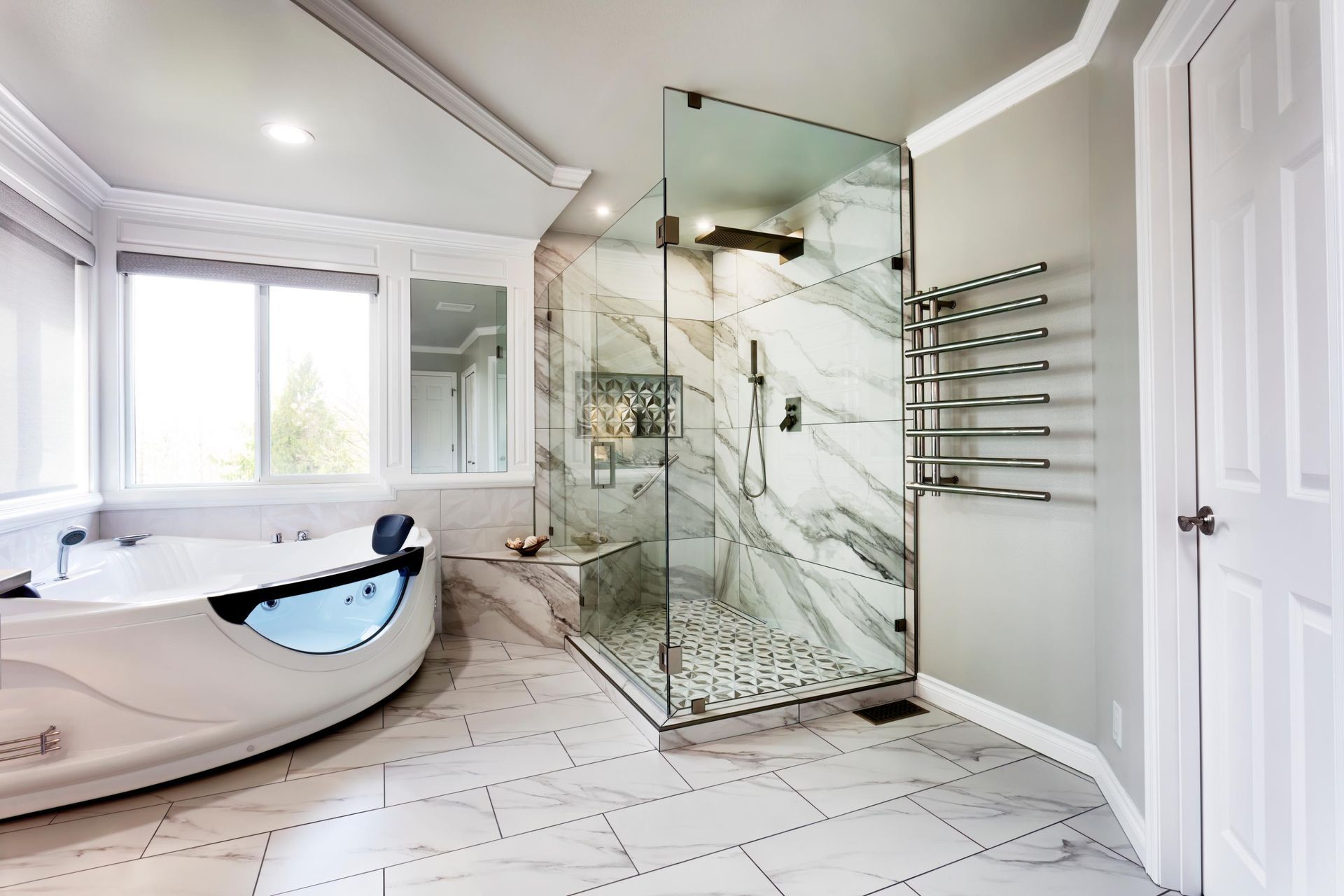 A bathroom with a tub and a walk in shower.