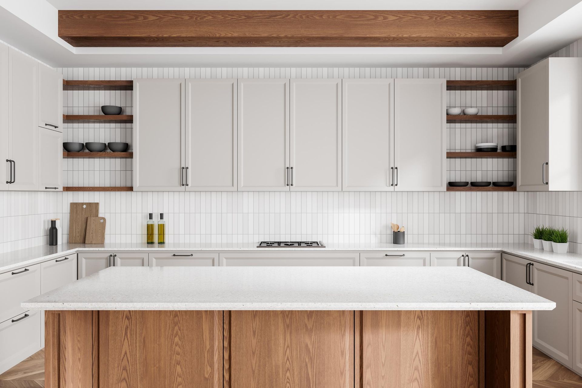 A kitchen with white cabinets and a wooden island.