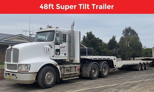 A semi truck with a 48 ft super tilt trailer