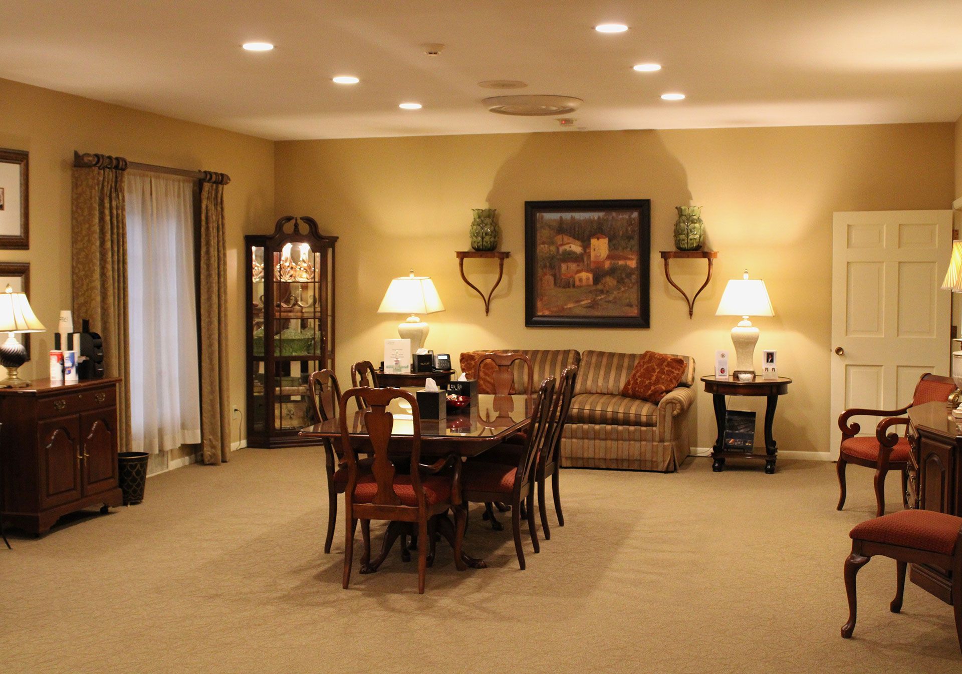 A living room with a table and chairs and a couch