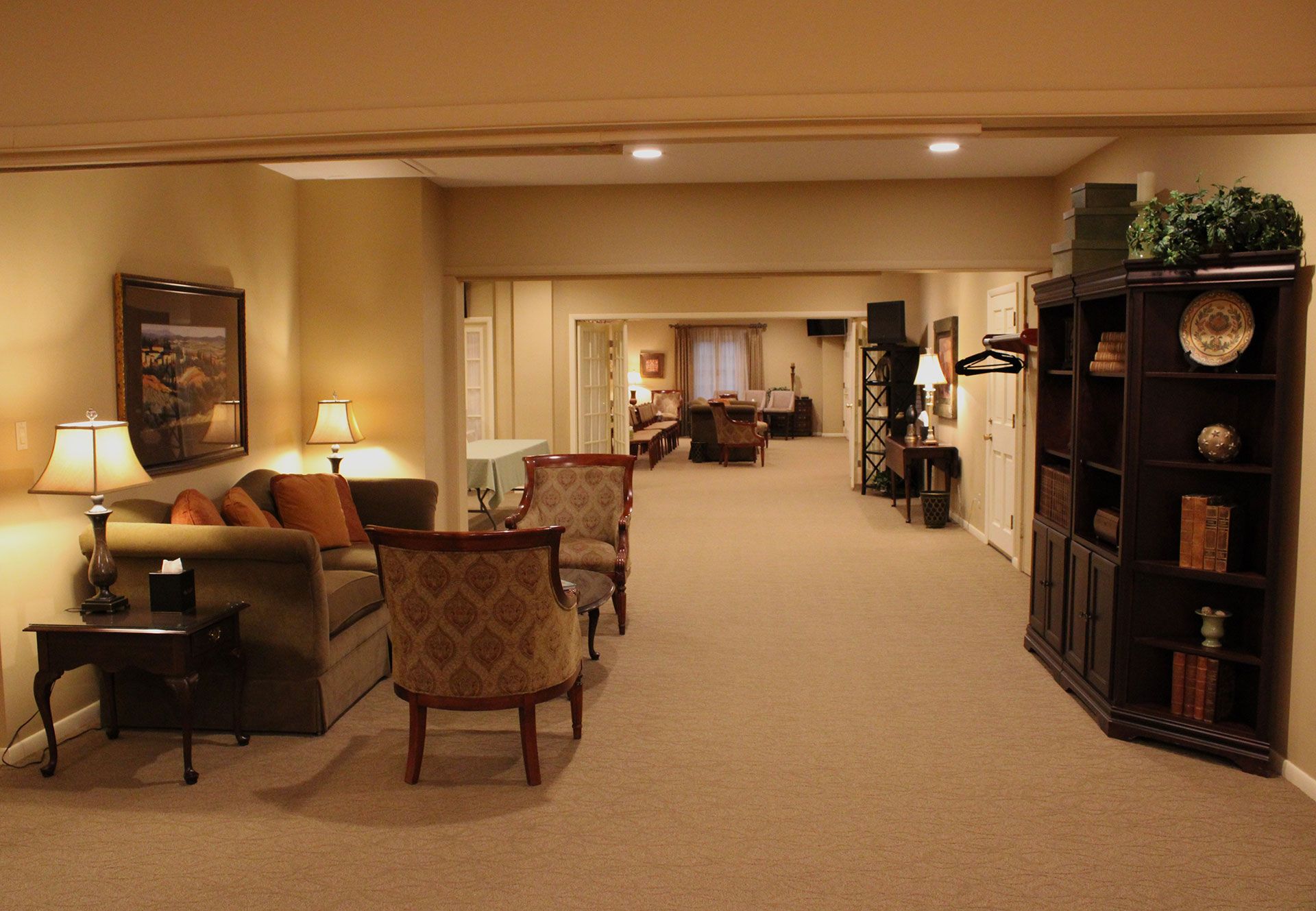 A living room with a couch and chairs in it