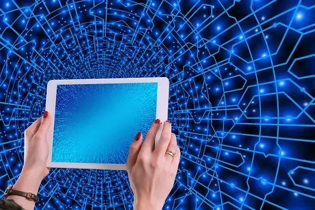 Person's finger pointing toward blue digital network with glowing nodes and lines.