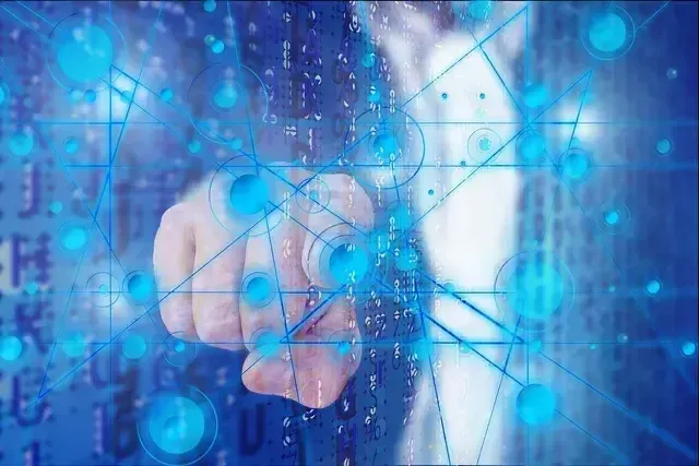 A hand touching a digital interface with glowing blue lines, circles, and data streams.