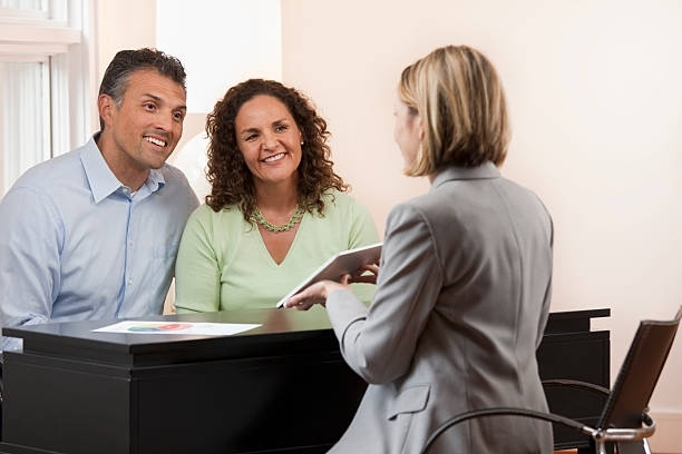 Couple talking with a financial advisor.
