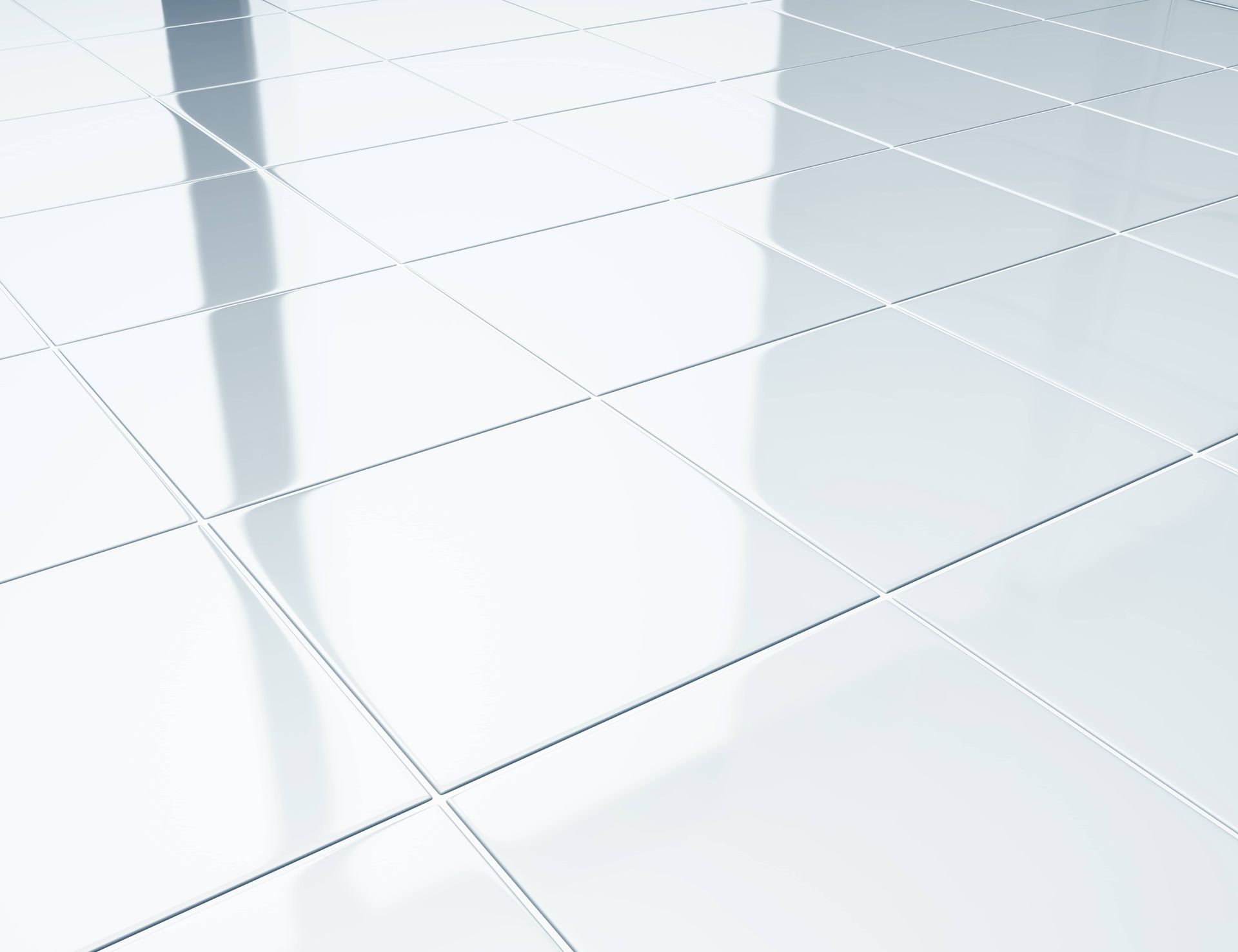 A white tiled floor with a reflection of a building in it