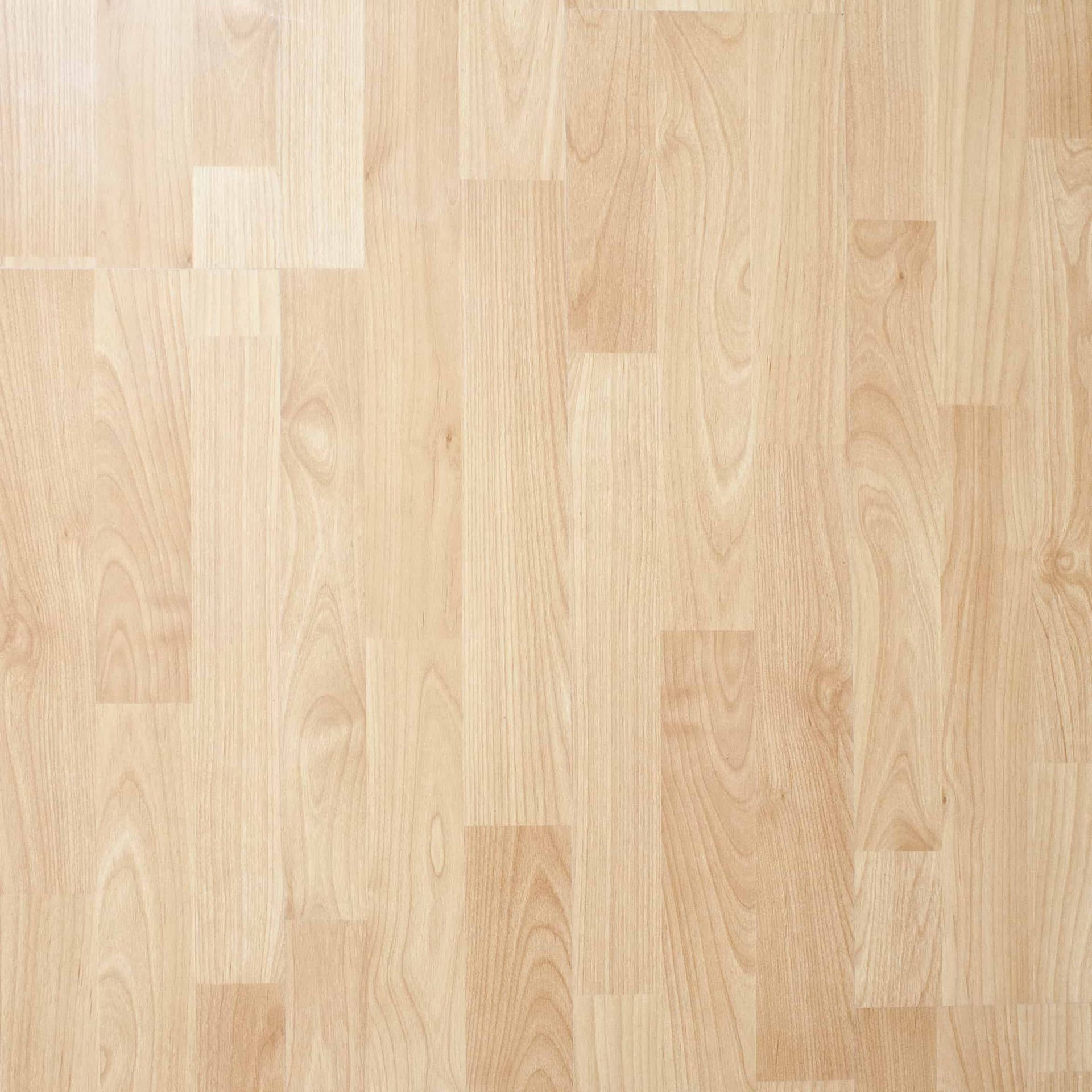 A close up of a wooden floor with a geometric pattern.