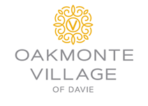 The logo for oakmonte village of davie has a yellow circle with a v on it.