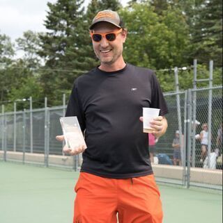 Paul Kolenich holds sportsmanship trophy