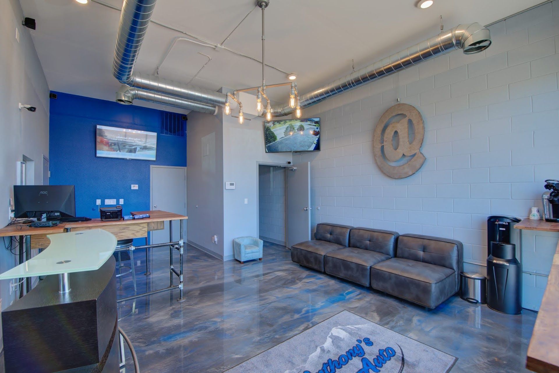 Modern Waiting Area with Sofa and TV in Auto Shop | Anthony's Pro Auto