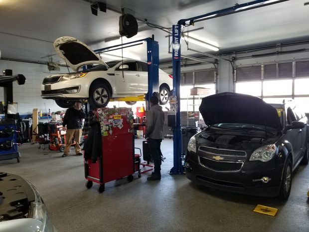 Technicians Working on Vehicles in Auto Repair Shop | Anthony's Pro Auto