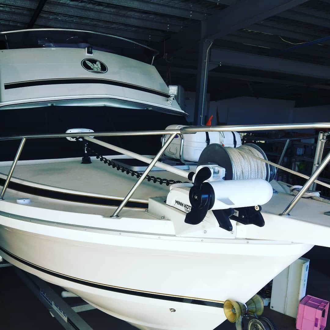 White Boat With Black Accents in a Covered Area — Boycey's Custom Engineering in Atherton, QLD