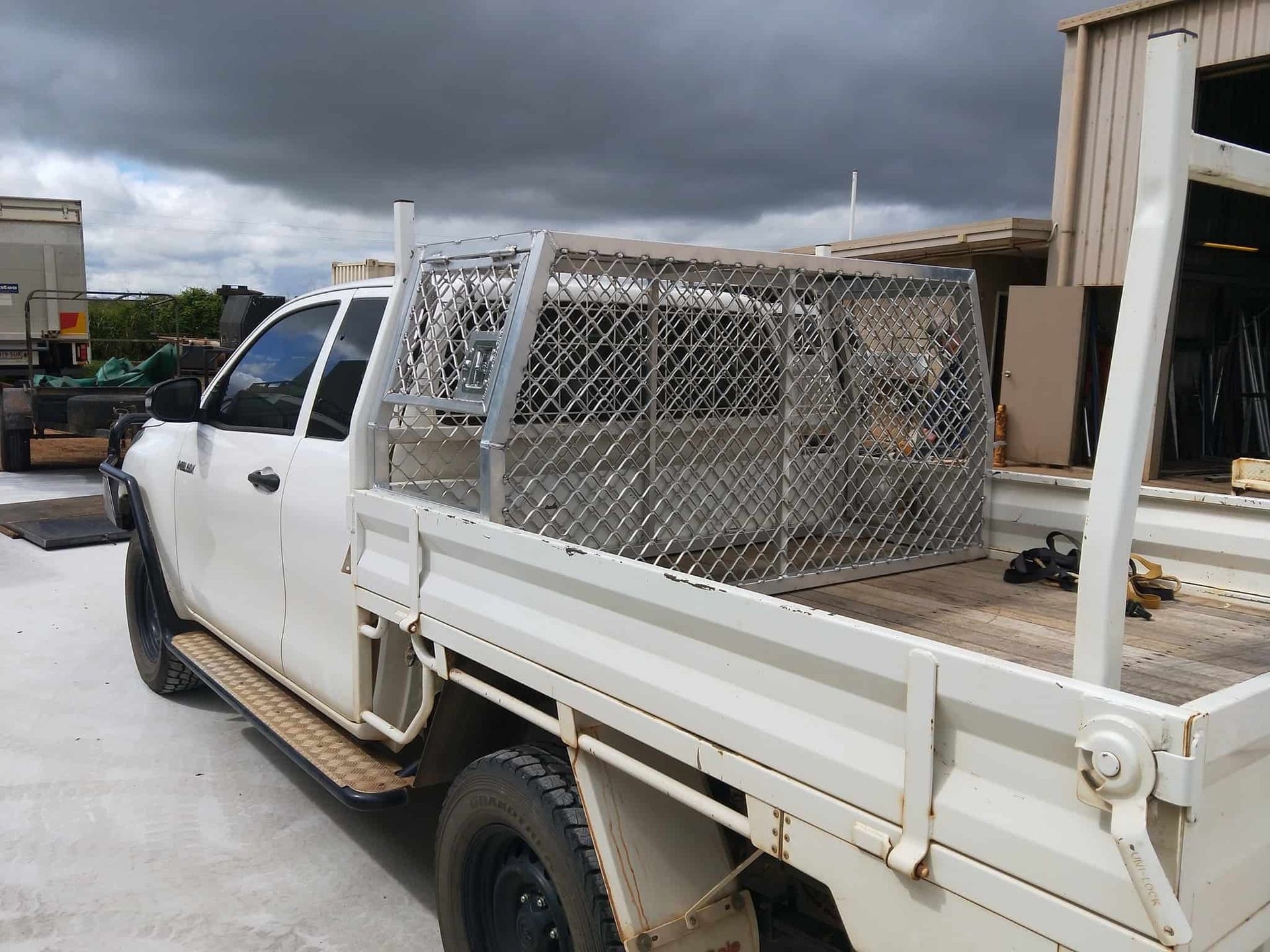 White Work Truck With a Metal Cage in the Bed — Boycey's Custom Engineering in Atherton, QLD