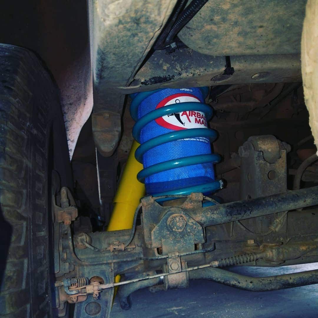 Blue Air Spring on a Vehicle's Suspension System — Boycey's Custom Engineering in Atherton, QLD