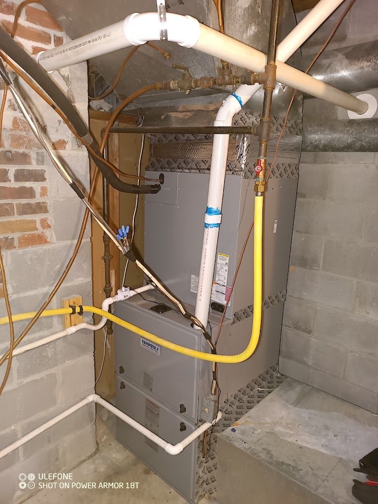 A picture of an air conditioner in a basement.
