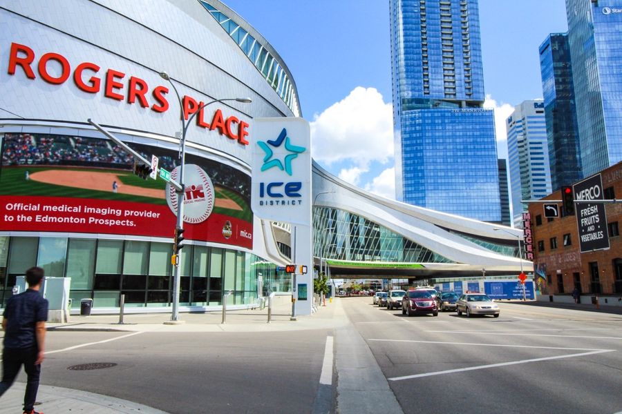 A streetscape of Rogers Place in Edmonton the Legends furnished suite building in the background