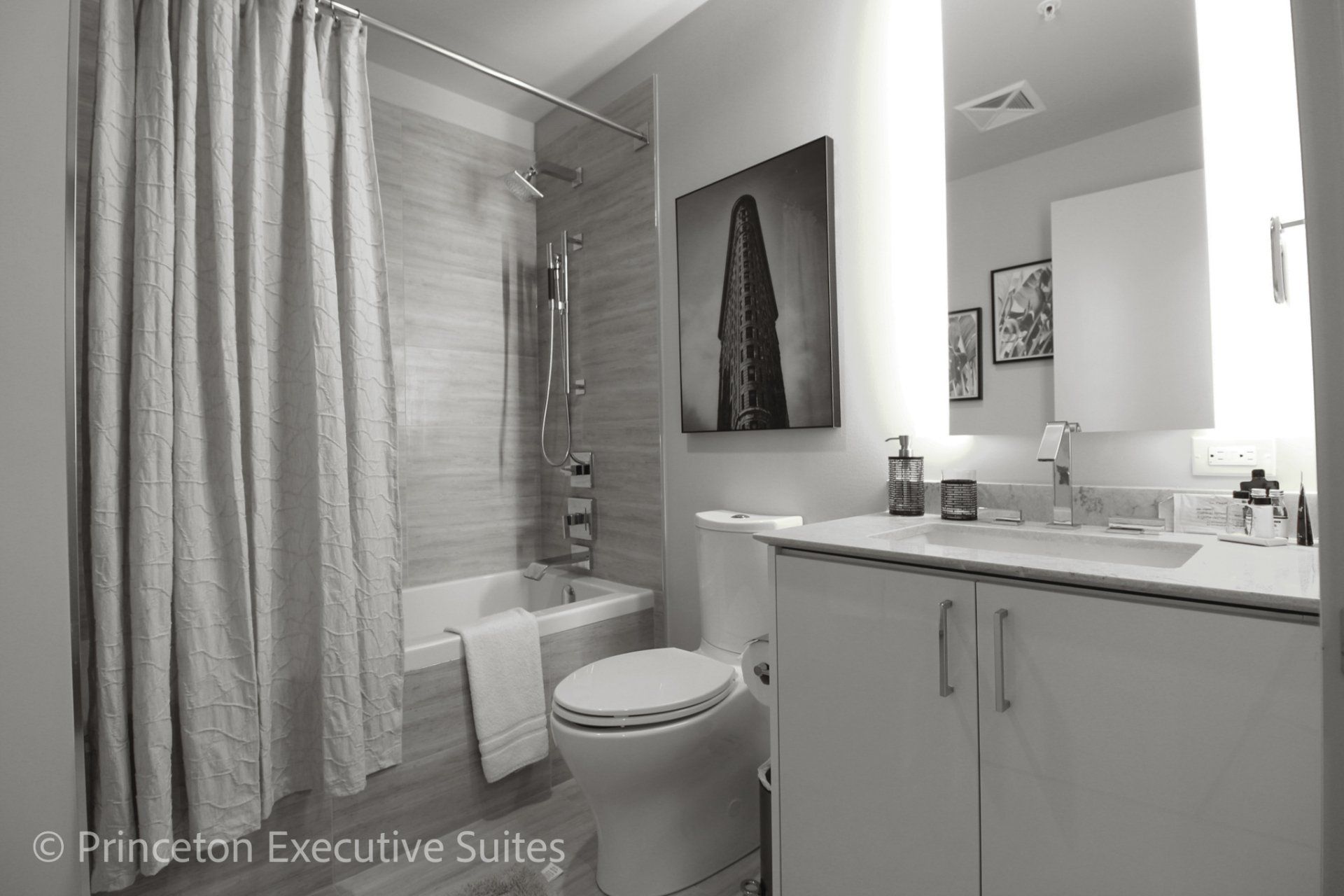 Modern bathroom shower deep soaker tub combo in this furnished apartment tin downtown edmonton
