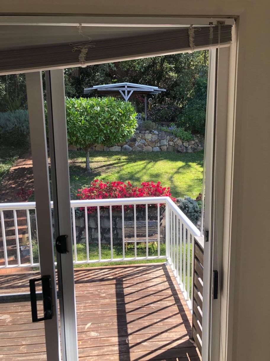 A Sliding Glass Door Leading To A Deck With A Gazebo In The Background — Central Coast Flyscreen Service In West Gosford, NSW