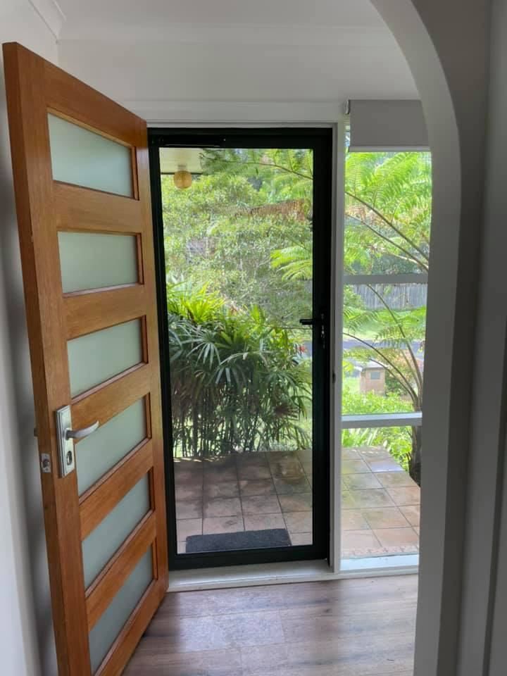 A Wooden Door With A Glass Door In A House — Central Coast Flyscreen Service In West Gosford, NSW