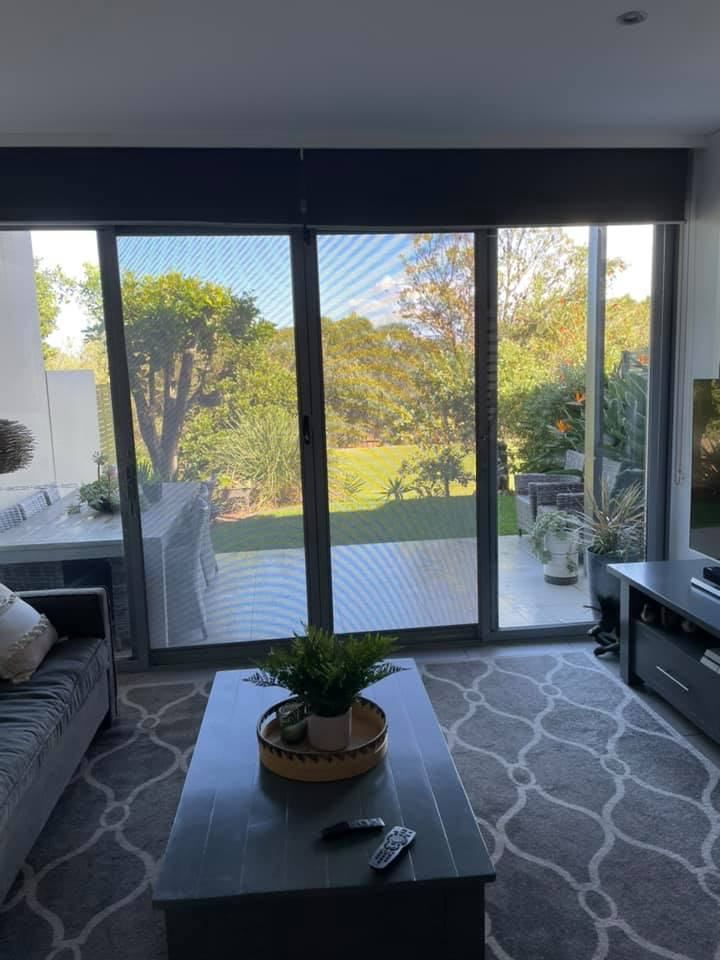 A Living Room With A Couch, Coffee Table, Television — Central Coast Flyscreen Service In Woy Woy, NSW