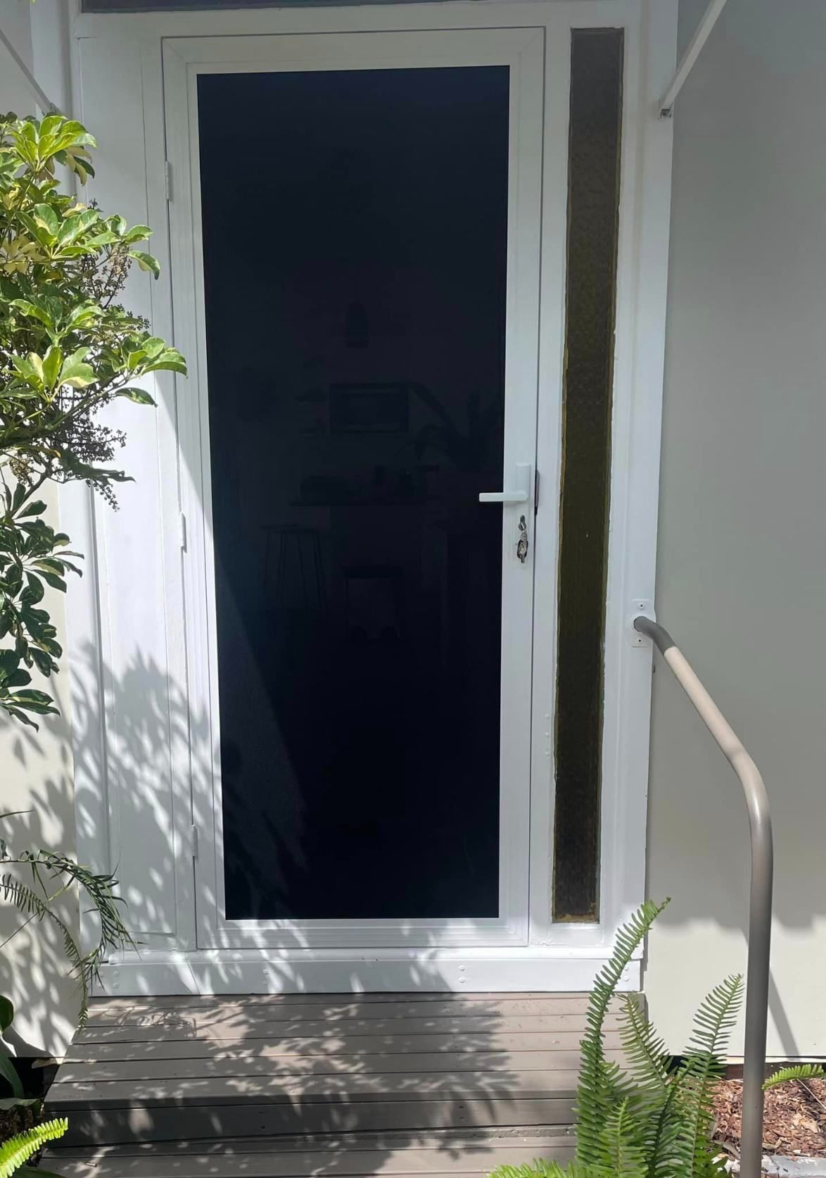 A White Door With A Black Screen — Central Coast Flyscreen Service In West Gosford, NSW