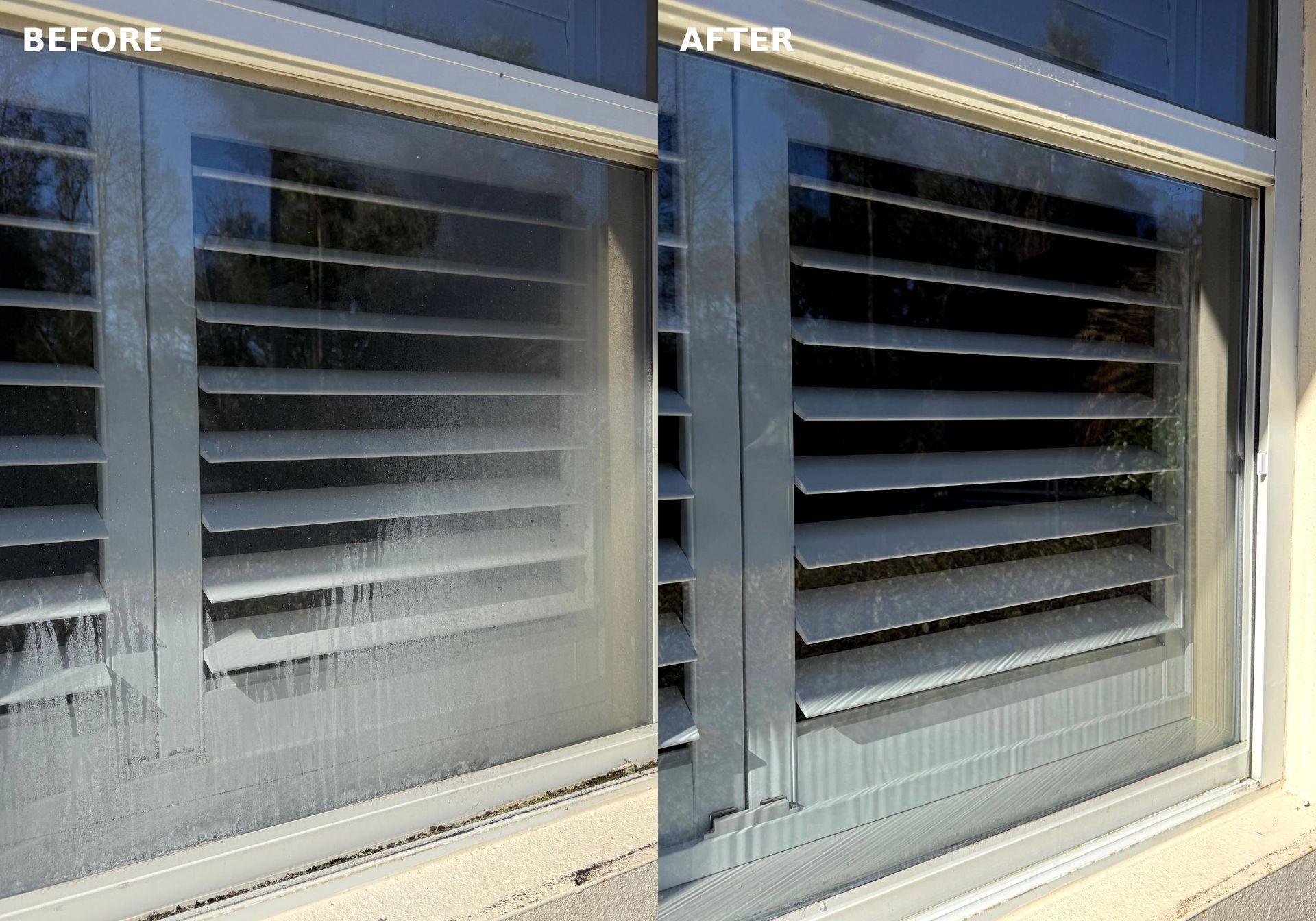 Stained glass window with an arched top, featuring floral and geometric designs, set in a dark frame.