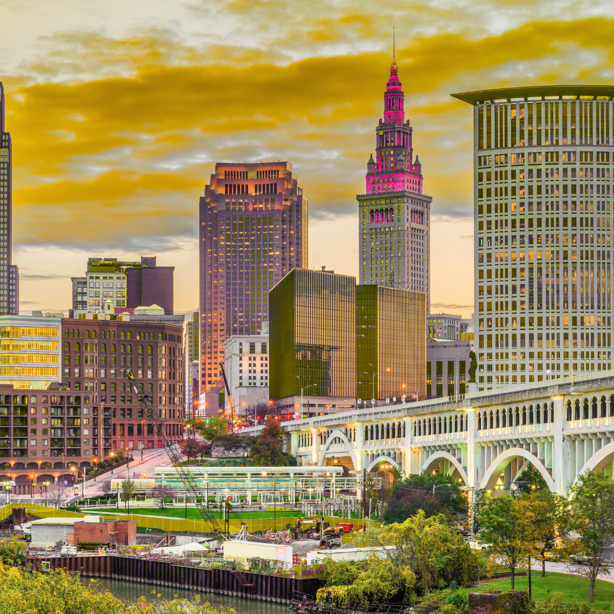 A city skyline with a pink tower in the middle