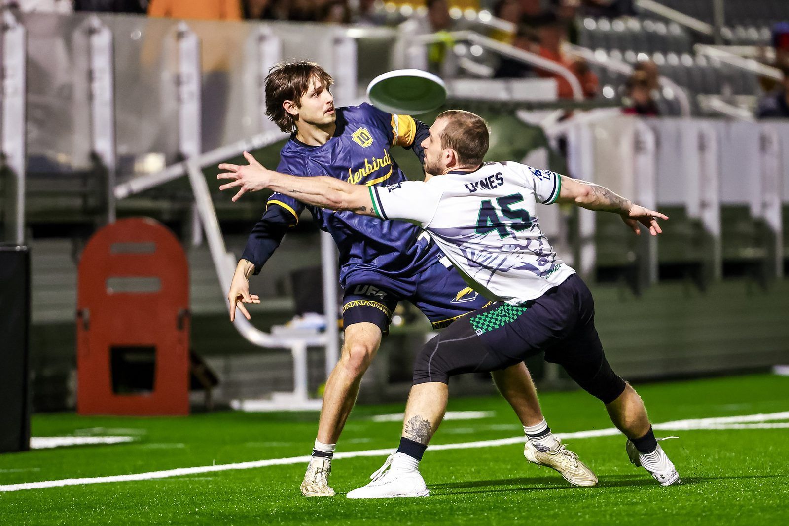 Thunderbirds player attempting to throw past a defender