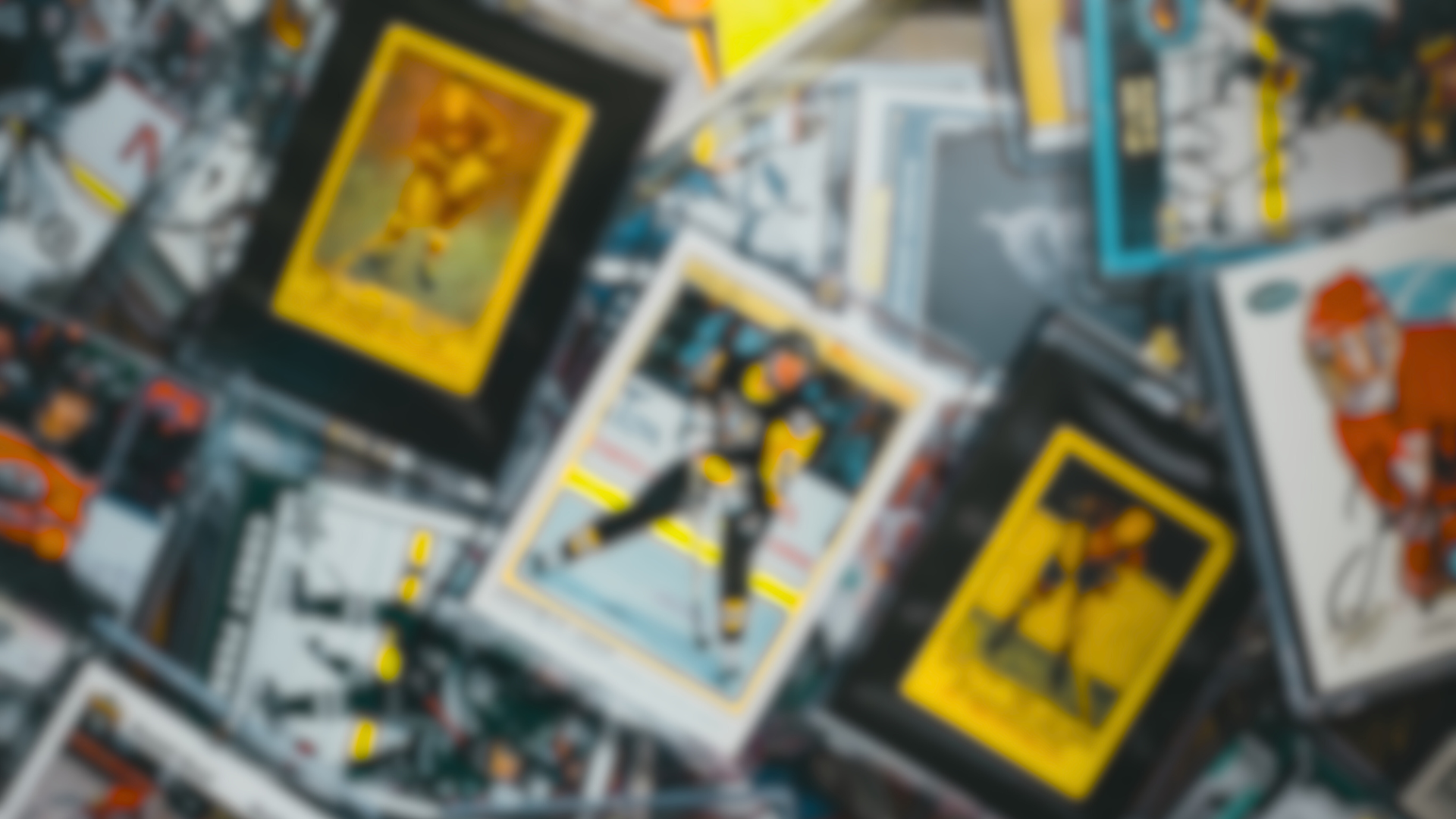 A bunch of hockey cards are stacked on top of each other on a table.