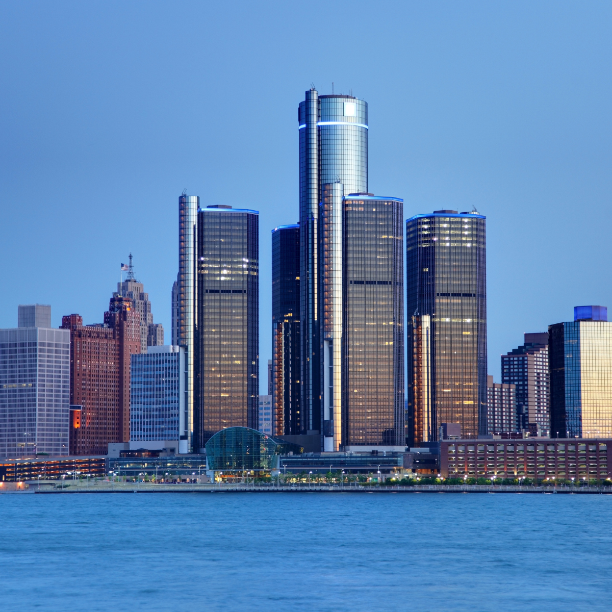 A city skyline with a large body of water in the foreground