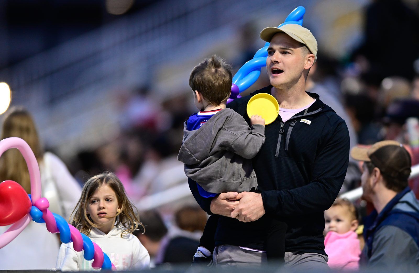 A father and child enjoying the game
