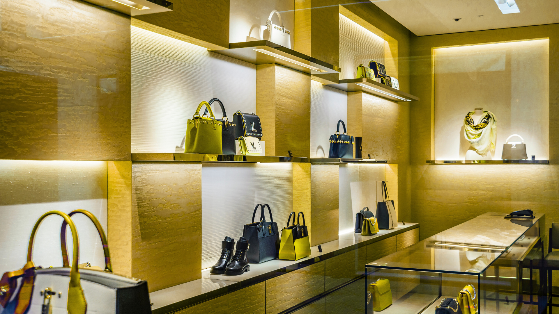 A store filled with lots of bags and shoes on shelves.
