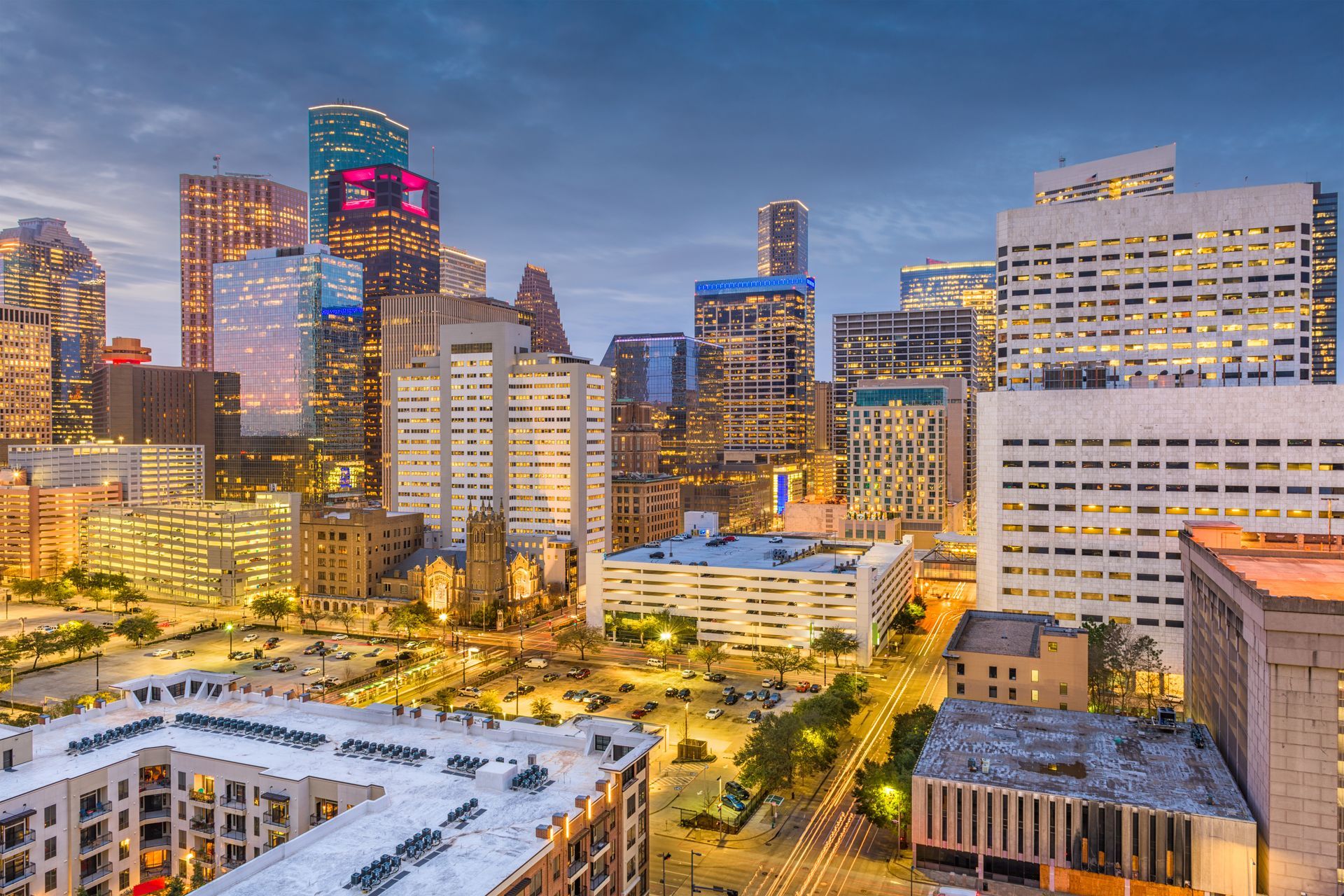 An aerial view of a city skyline at night.